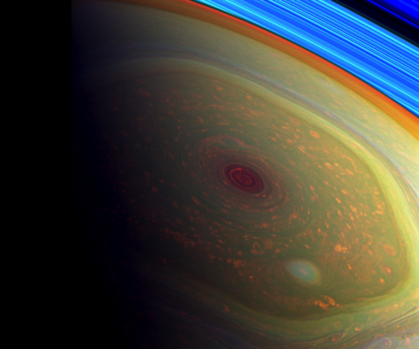 A false-color image highlighting Saturn’s hurricane over its north pole, inside the much larger hexagon-shaped feature. Image credit: NASA/JPL-Caltech/SSI.
