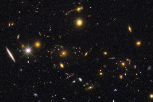 Cosmic rarities, like merging galaxies (top) and gravitational lensing phenomena (middle) can be seen at various points in the image. Image credit: NASA, ESA, R. Windhorst, S. Cohen, M. Mechtley, and M. Rutkowski (Arizona State University, Tempe), R. O'Connell (University of Virginia), P. McCarthy (Carnegie Observatories), N. Hathi (University of California, Riverside), R. Ryan (University of California, Davis), H. Yan (Ohio State University), and A. Koekemoer (Space Telescope Science Institute).