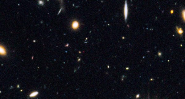 The Great Observatories Origins Deep Studies North field (GOODS-N), cropped to show the Universe's most distant galaxy, in red. All four of these circumstances needed to come together at once to make this galaxy's discovery possible. Image credit: NASA, ESA, G. Illingworth (University of California, Santa Cruz), P. Oesch (University of California, Santa Cruz; Yale University), R. Bouwens and I. Labbé (Leiden University), and the Science Team.