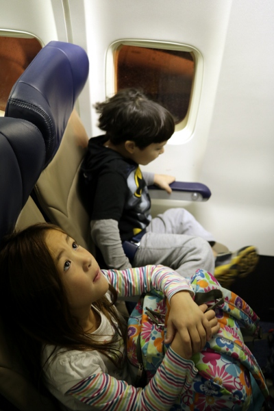 SteelyKid and The Pip in their seats on the plane to Florida.