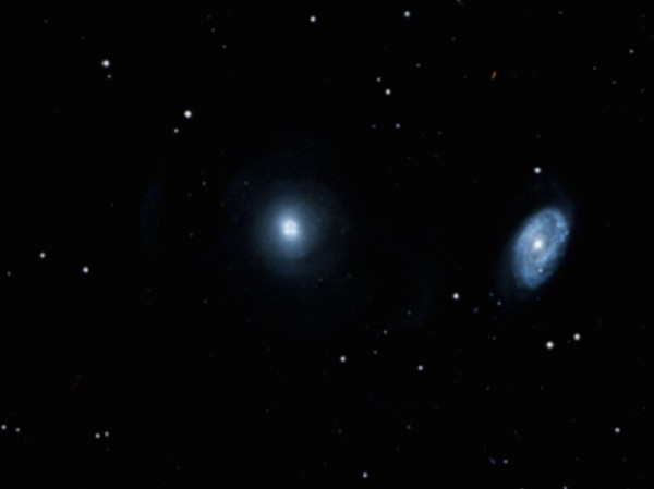 An SDSS image of elliptical galaxy NGC474 (center) and spiral galaxy NGC470 (right).