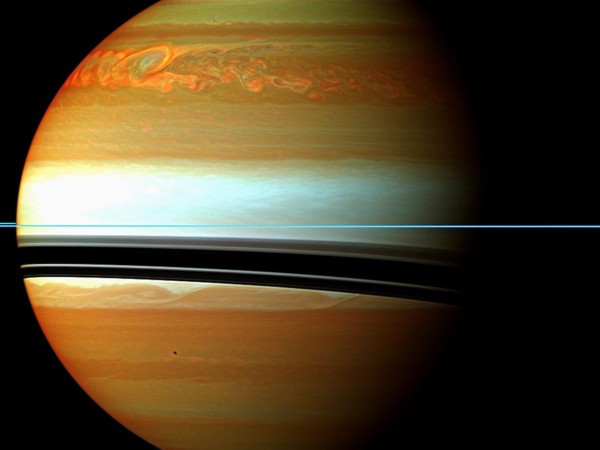 Image credit: NASA / JPL-Caltech / Space Science Institute, of Saturn (during its storm) in false-color.
