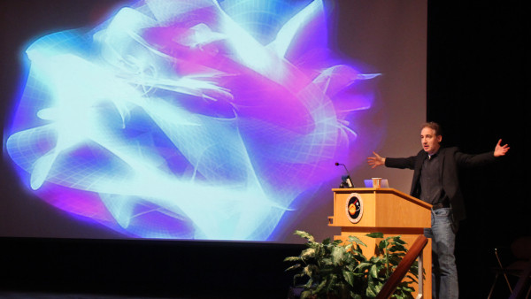 Image credit: NASA/Goddard/Wade Sisler, of Brian Greene presenting on String Theory.