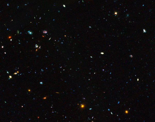 Image credit: NASA, ESA, the GOODS Team and M. Giavalisco (STScI/University of Massachusetts), of a region of the GOODS field with a large number of dwarf galaxies, an important contributor to star formation.