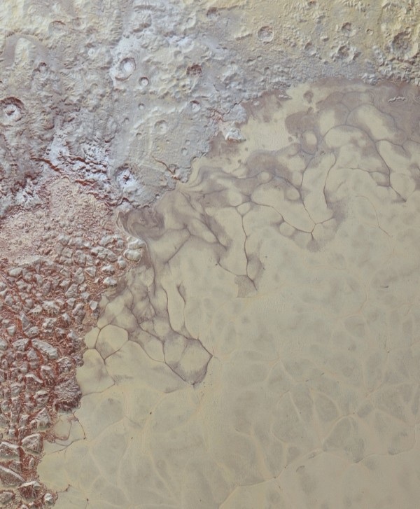 Image credit: NASA/JHUAPL/SwRI, of the interface between the heart-shaped region (lower right) and the mountainous terrain (upper left) that show severe color differences as well.