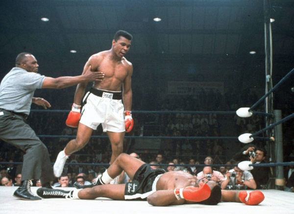 Ali taunting a fallen Sonny Liston in the first round of their second fight. Image credit: AP, via http://interactives.ap.org/2015/ali-liston-fight/.