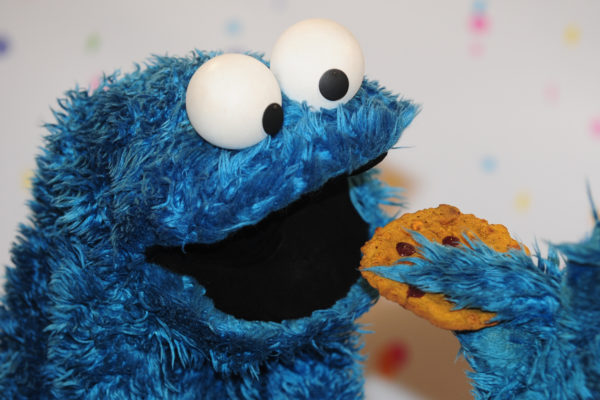 Cookie monster may be famous for eating cookies, but well over 90% of the cookie finds its way splattered out the sides of his mouth, much like the matter that falls onto black holes. Image credit: Revierfoto/dpa/picture-alliance/Newscom.
