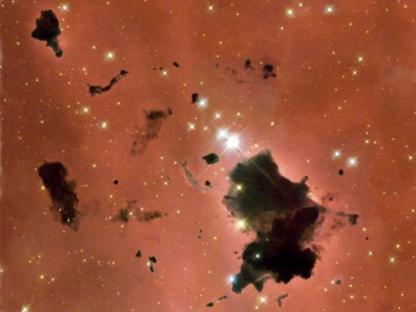 Gas and dust in the nebula IC 2944, along with new stars. Image credit: NASA/ESA and The Hubble Heritage Team (STScI/AURA).