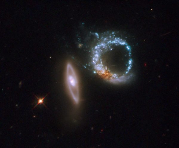The gravitationally interacting system, Arp 147. Image credit: Arp 147, via NASA, ESA, and M. Livio (STScI).