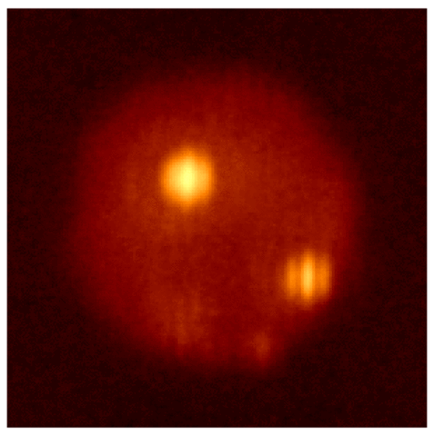 The occultation of Jupiter's moon, Io, with its erupting volcanoes Loki and Pele, as occulted by Europa, which is invisible in this infrared image. GMT will provide significantly enhanced resolution and imaging. Image credit: LBTO.