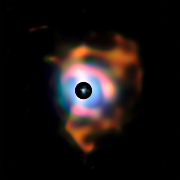 The nebula of expelled matter created around Betelgeuse, which, for scale, is shown in the interior red circle. This structure, resembling flames emanating from the star, forms because the behemoth is shedding its material into space. Image credit: ESO / P. Kervella.