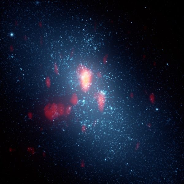 Gas outflows occur in dwarf galaxies when intense star formation occurs, expelling normal matter while leaving dark matter behind. Image credit: J. Turner.