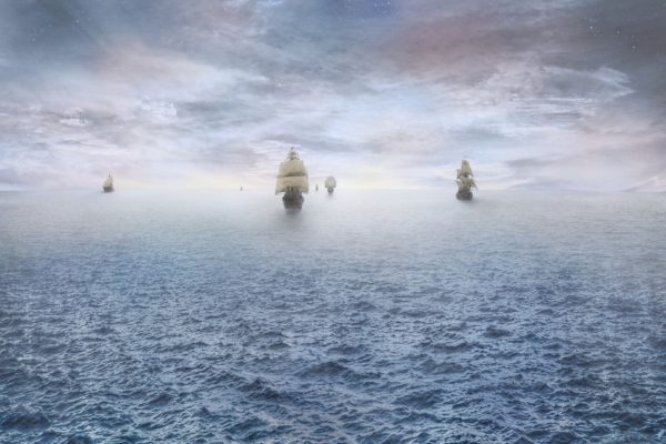 As ships sail farther away, a larger fraction of their hulls, sails and masts become obscured by the horizon, due to the curvature of the Earth. Image credit: stealth_sly of Pixabay.