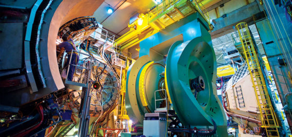 By colliding particles together at high energies inside a sophisticated detector, like Brookhaven's PHENIX detector at RHIC, have led the way in measuring the spin contributions of gluons. Image credit: Brookhaven National Laboratory.