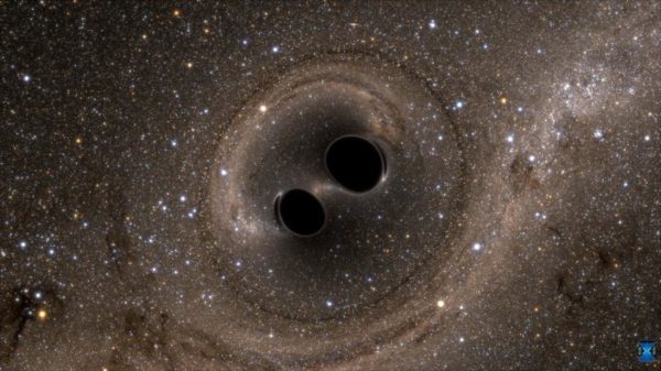Two merging black holes. Image credit: SXS, the Simulating eXtreme Spacetimes (SXS) project (http://www.black-holes.org).